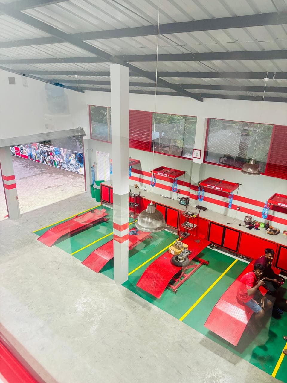 Wide view of the service station with four motorcycle lifts